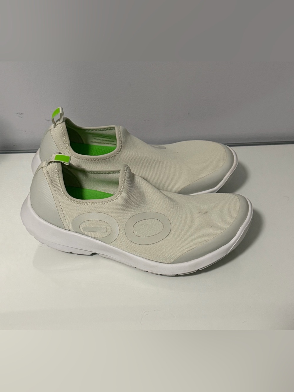 OOFOS Women's Slip-On Sneakers in Cream with Lime Green Accents
